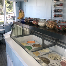 Front Counter of restaurant with selections of Ice Cream flavors.